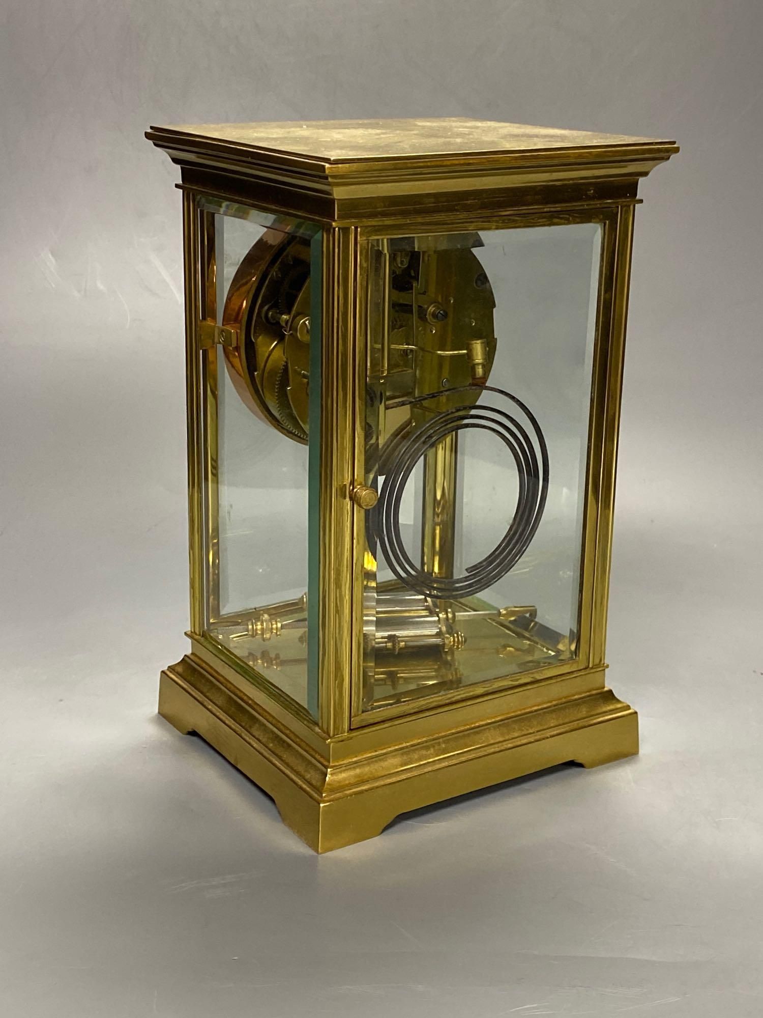 A lacquered brass four-glass mantel clock, Waterbury Clock Co., USA, gong striking movement, height 24cm